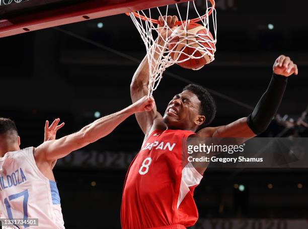 Rui Hachimura of Team Japan dunks the ball against Luca Vildoza of Team Argentina during the second half of a Men's Basketball Preliminary Round...