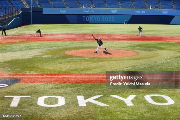 Pitcher Carlos Bustamante of Team Mexico pitches in the ninth inning against Team Israel during round one of baseball team competition on day nine of...