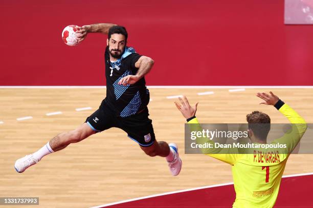 Ignacio Pizarro of Team Argentina shoots at goal as Gonzalo Perez de Vargas Moreno of Team Spain looks to defend during the Men's Preliminary Round...