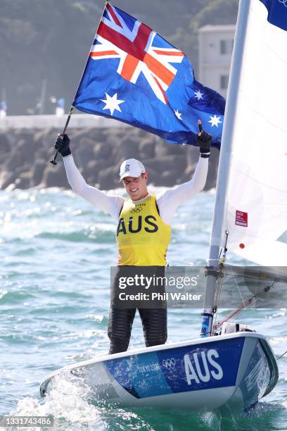 Matt Wearn of Team Australia celebrates winning gold after finishing first in the Men's Laser class on day nine of the Tokyo 2020 Olympic Games at...