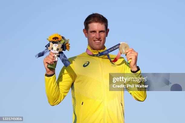 Matt Wearn of Team Australia poses with the gold medal for finishing first in the Men's Laser class on day nine of the Tokyo 2020 Olympic Games at...