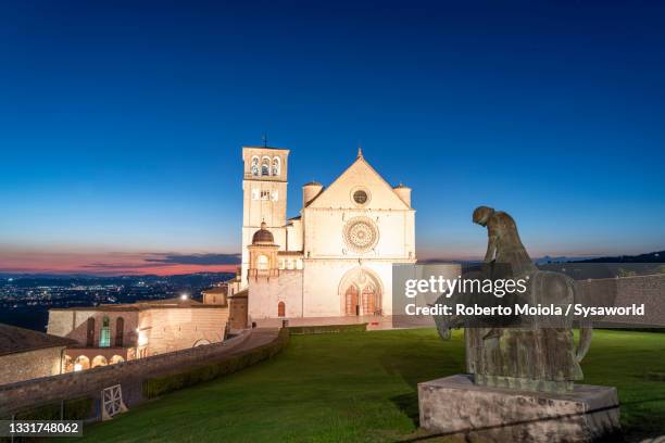 basilica di san francesco d'assisi at dusk, assisi - saint francis of assisi stock pictures, royalty-free photos & images