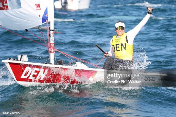 Anne-Marie Rindom of Team Denmark celebrates after winning the Women's Laser Radial class on day nine of the Tokyo 2020 Olympic Games at Enoshima...