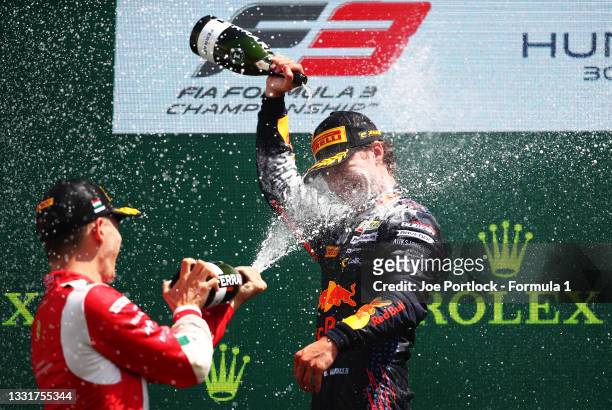 Race winner Dennis Hauger of Norway and Prema Racing and second placed Arthur Leclerc of Monaco and Prema Racing celebrate on the podium during Round...