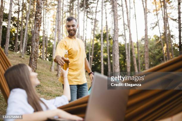 boyfriend and girlfriend having weekend in nature - grant forrest stock pictures, royalty-free photos & images