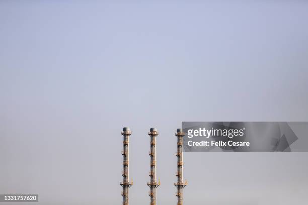 chimneys of an industrial power plant - coal plant stock pictures, royalty-free photos & images