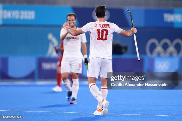 David Alegre Biosca of Team Spain celebrates with teammate Alvaro Iglesias Marcos after scoring their team's first goal during the Men's Quarterfinal...