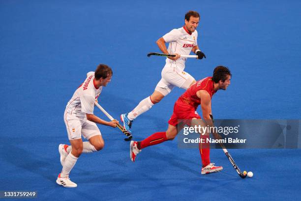 Alvaro Iglesias Marcos and Maria Basterra Jose of Team Spain chase down Arthur Vvn Doren of Team Belgium during the Men's Quarterfinal match between...