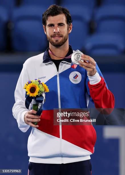 Silver medalist Karen Khachanov of Team ROC poses on the podium during the medal ceremony for Tennis Men's Singles on day nine of the Tokyo 2020...