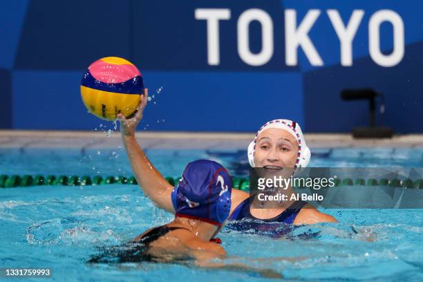Elvina Karimova of Team ROC passes under pressure from Yumi Arima of Team Japan during the Women's Preliminary Round Group B match between Team ROC...