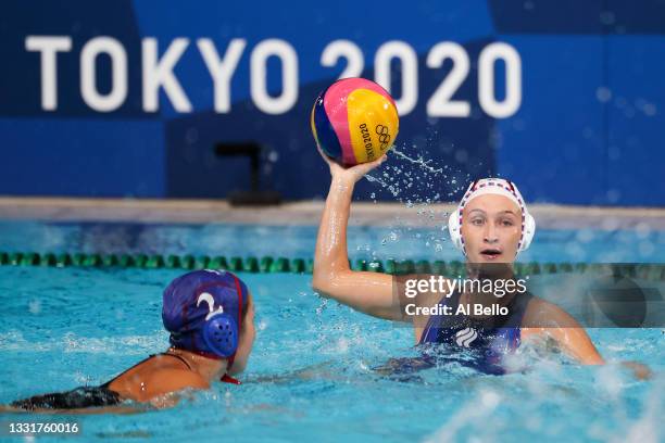 Elvina Karimova of Team ROC passes under pressure from Yumi Arima of Team Japan during the Women's Preliminary Round Group B match between Team ROC...