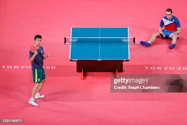 Vitor Ishiy of Team Brazil celebrates after winning his Men's Team Round of 16 table tennis match against Dimitrije Levajac of Team Serbia on day...