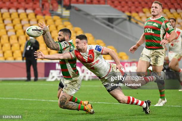 In this handout image provided by NRL Photos Adam Reynolds of the Rabbitohs scores a try during the round 20 NRL match between the St George...