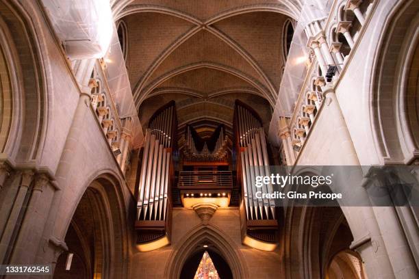 view of the pipe organ of the cathedral of notre dame in lausanne - lausanne cathedral notre dame stock pictures, royalty-free photos & images