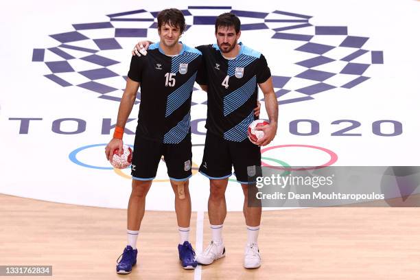 Gonzalo Matias Carou and Sebastian Alejandro Simonet of Team Argentina pose for a photo after losing the Men's Preliminary Round Group A handball...