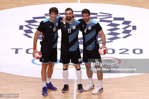 Gonzalo Matias Carou, Lucas Dario Moscariello and Sebastian Alejandro Simonet of Team Argentina pose for a photo after losing the Men's Preliminary...