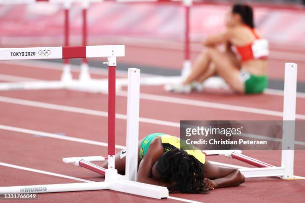 Yanique Thompson of Team Jamaica crashes into a hurdle during the Women's 100m Hurdles Semi-Final on day nine of the Tokyo 2020 Olympic Games at...