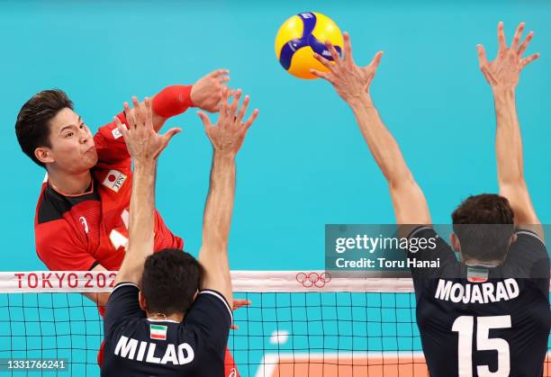 Yuji Nishida of Team Japan competes against H. Milad Ebadipour Ghara and Aliasghar Mojarad of Team Iran during the Men's Preliminary Round - Pool A...