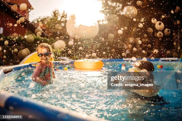summer water games - above ground pool stock pictures, royalty-free photos & images
