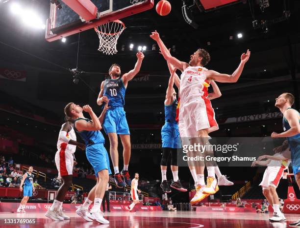 Mike Tobey of Team Slovenia and Pau Gasol of Team Spain go up for a rebound during the second half of a Men's Basketball Preliminary Round Group C...