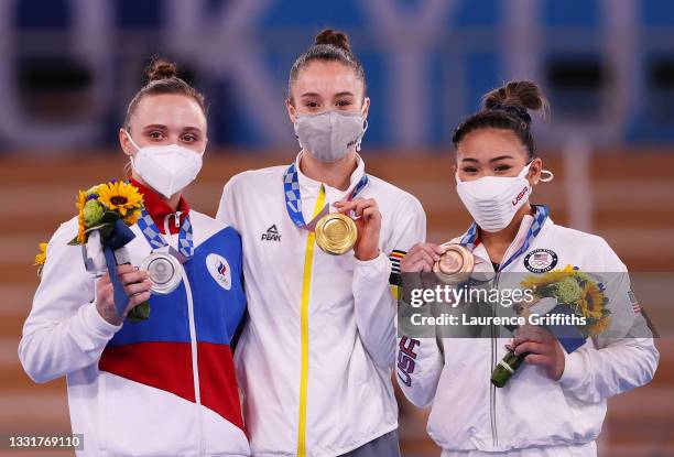 Silver medalist Anastasiia Iliankova of Team ROC, gold medalist Nina Derwael of Team Belgium and bronze medalist Sunisa Lee of Team United States...