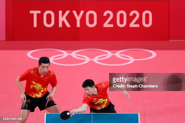 Xu Xin and Ma Long of Team China in action during their Men's Team Round of 16 table tennis match on day nine of the Tokyo 2020 Olympic Games at...