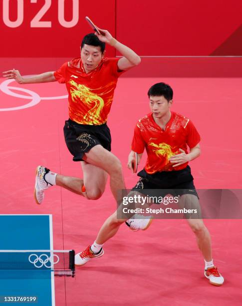 Xu Xin and Ma Long of Team China in action during their Men's Team Round of 16 table tennis match on day nine of the Tokyo 2020 Olympic Games at...