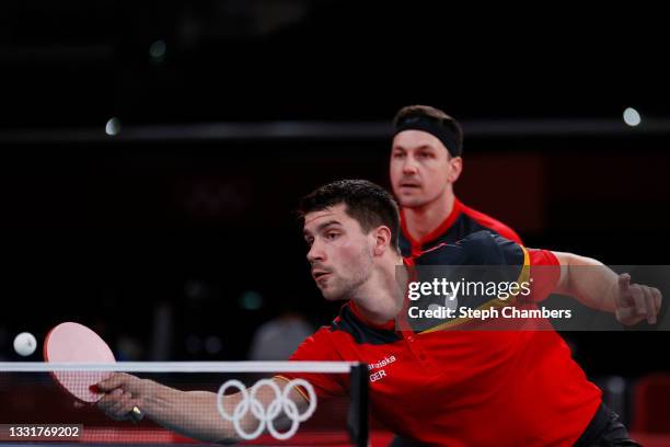 Dimitrij Ovtcharov and Timo Boll of Team Germany in action during his Men's Team Round of 16 table tennis match on day nine of the Tokyo 2020 Olympic...