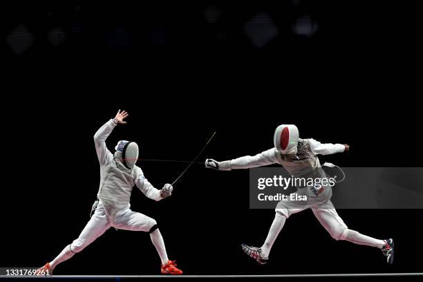 Kirill Borodachev of Team ROC competes against Enzo Lefort of Team France during the Men's Foil Team Team Fencing Gold Medal Match on day nine of the...