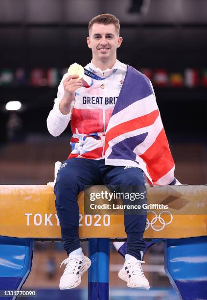 Gold medalist Max Whitlock of Team Great Britain poses with his medal following the Men's Pommel Horse Final on day nine of the Tokyo 2020 Olympic...