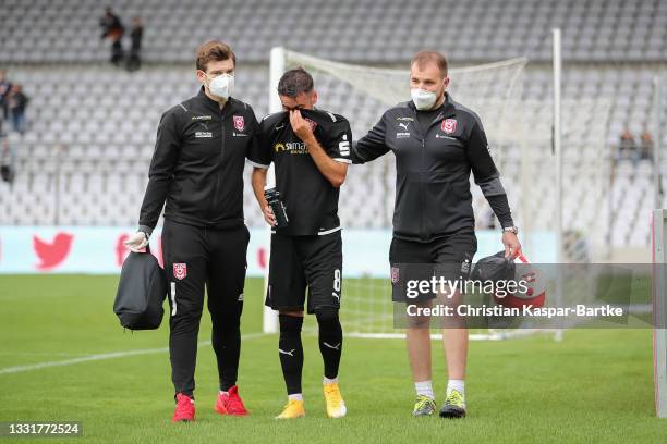 Niklas Kreuzer of Hallescher FC has to be replaced after his injury during the 3. Liga match between Türkgücü München and Hallescher FC at...