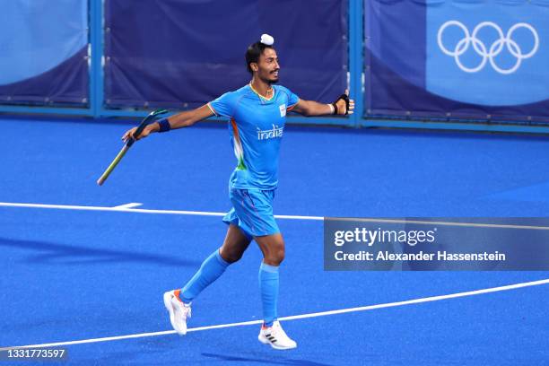 Dilpreet Singh of Team India celebrates after scoring their team's first goal during the Men's Quarterfinal match between India and Great Britain on...