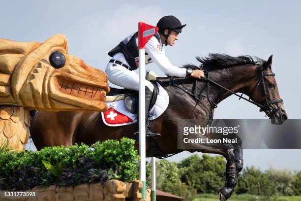 Felix Vogg of Team Switzerland riding Colero clears a jump during the Eventing Cross Country Team and Individual on day nine of the Tokyo 2020...