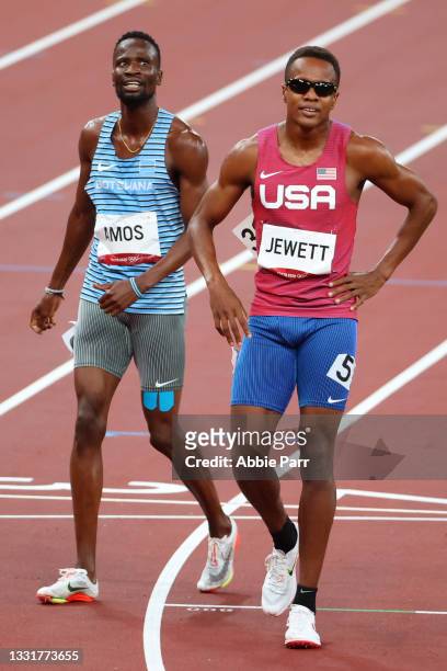 Nijel Amos of Team Botswana and Isaiah Jewett of Team United States react as they cross the finish line after falling during the Men's 800 Meters...