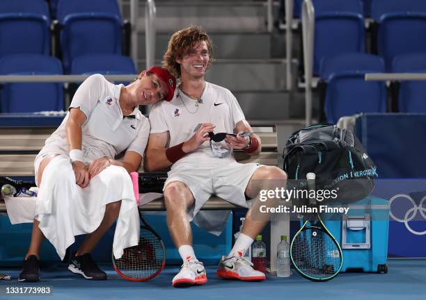 Anastasia Pavlyuchenkova of Team ROC and Andrey Rublev of Team ROC celebrate victory after their Mixed Doubles Gold Medal match against Elena Vesnina...