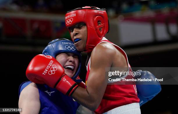 Ingrit Lorena Valencia Victoria of Team Colombia exchanges punches with Tsukimi Namiki of Team Japan during the Women's Fly quarter final on day nine...