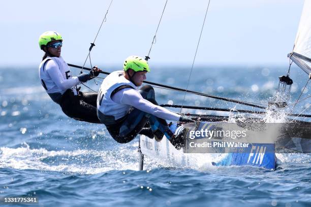 Sinem Kurtbay and Akseli Keskinen of Team Finland compete in the Nacra 17 Foiling class on day nine of the Tokyo 2020 Olympic Games at Enoshima Yacht...