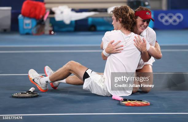 Anastasia Pavlyuchenkova of Team ROC and Andrey Rublev of Team ROC celebrate victory after their Mixed Doubles Gold Medal match against Elena Vesnina...