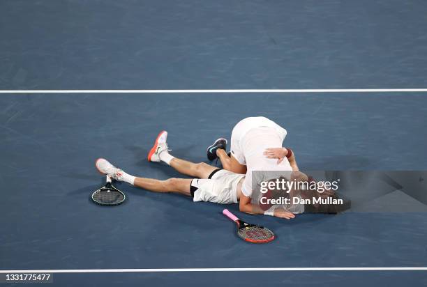 Anastasia Pavlyuchenkova of Team ROC and Andrey Rublev of Team ROC celebrate victory after their Mixed Doubles Gold Medal match against Elena Vesnina...