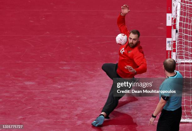 Andreas Wolff of Team Germany attempts to save a goal during the Men's Preliminary Round Group A handball match between Germany and Brazil on day...