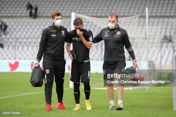 Niklas Kreuzer of Hallescher FC has to be replaced after his injury during the 3. Liga match between Türkgücü München and Hallescher FC at...