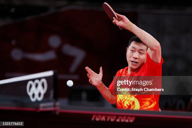 Xu Xin of Team China in action during his Men's Team Round of 16 table tennis match on day nine of the Tokyo 2020 Olympic Games at Tokyo Metropolitan...