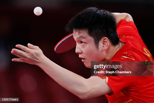 Fan Zhengdong of Team China serves the ball during their Men's Team Round of 16 table tennis match on day nine of the Tokyo 2020 Olympic Games at...