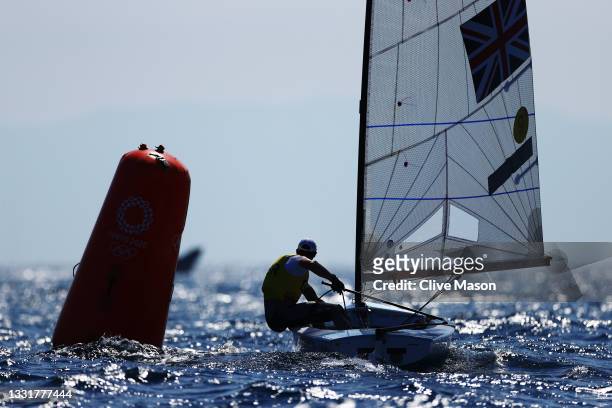 Giles Scott of Team Great Britain competes in the Men's Finn class on day nine of the Tokyo 2020 Olympic Games at Enoshima Yacht Harbour on August...