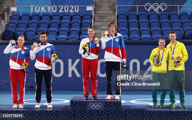 Silver medalists Elena Vesnina of Team ROC and Aslan Karatsev of Team ROC, gold medalists Anastasia Pavlyuchenkova of Team ROC and Andrey Rublev of...
