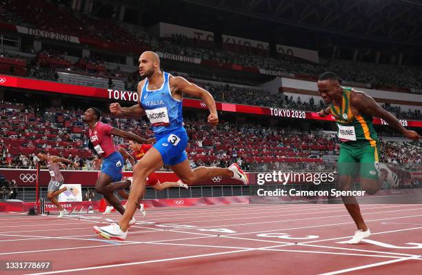 Lamont Marcell Jacobs of Team Italy wins the Men's 100m Final ahead of Fred Kerley of Team United States and Andre De Grasse of Team Canada on day...