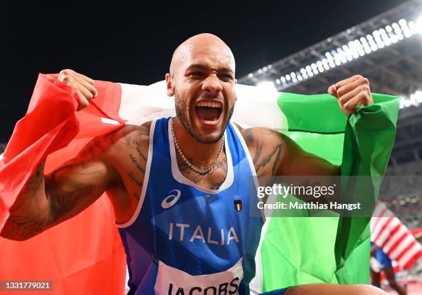 Lamont Marcell Jacobs of Team Italy celebrates after winning the Men's 100m Final on day nine of the Tokyo 2020 Olympic Games at Olympic Stadium on...