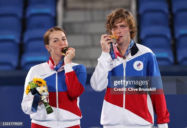 Gold medalists Anastasia Pavlyuchenkova of Team ROC and Andrey Rublev of Team ROC pose on the podium during the medal ceremony for Tennis Mixed...