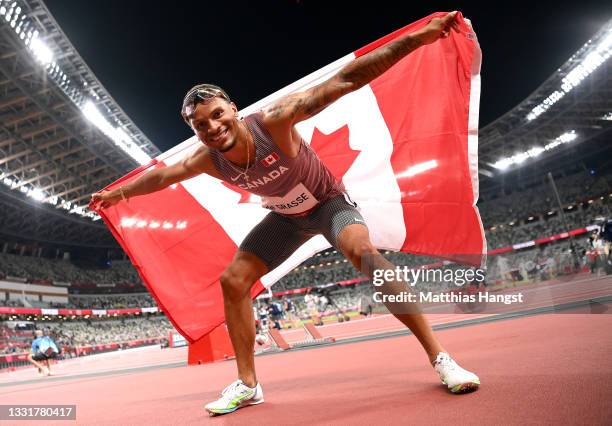 Andre De Grasse of Team Canada celebrates after winning the bronze medal in the Men's 100m Final on day nine of the Tokyo 2020 Olympic Games at...