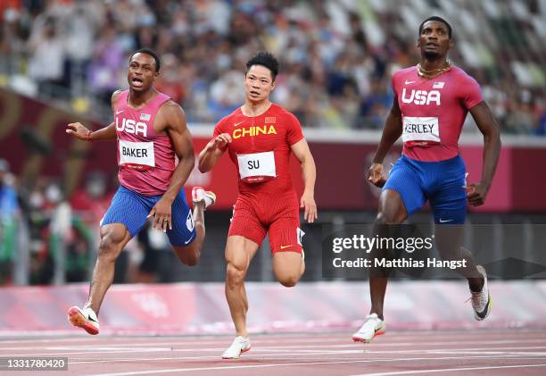 Ronnie Baker of Team United States, Su Bingtian of China and Fred Kerley of Team United States compete in the Men's 100m Final on day nine of the...